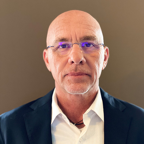 Portrait of Pascal Loyacono, Sales Director at B&W International for Africa and the Middle East, wearing a suit and glasses.