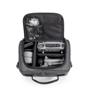 A top-down view of the drone.bag TEX.66.Mini5 | B&W bag for DJI Mini 5 Pro, black, displaying a drone, remote controller, and accessories neatly organized in compartments and mesh pockets.